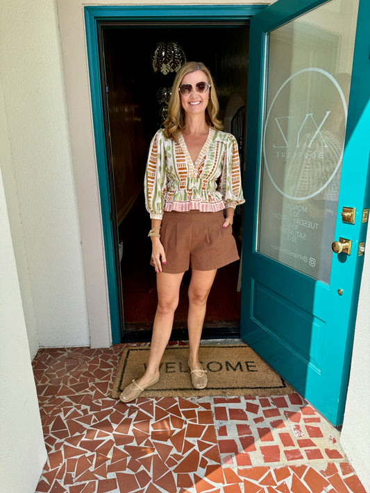 Bellini Cinched Waist Flared Hem Top